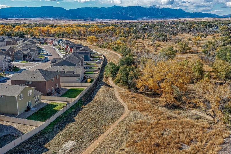 Aerial views of the trails and open space behind the home..