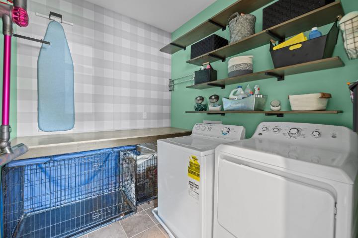 Large laundry room with built-in shelves
