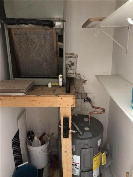 utility room in unit; A/C & water heater