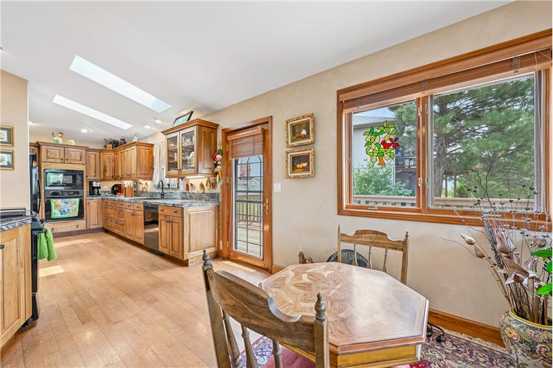 Breakfast nook with kitchen beyond