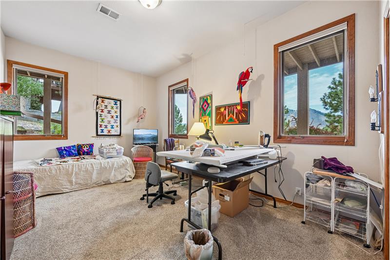 Guest bedroom in basement used as sewing room