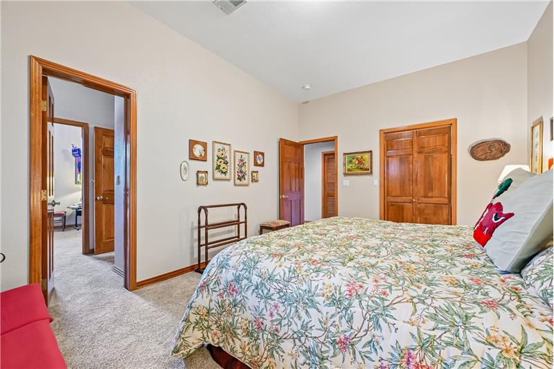 Reverse view of guest bedroom showing door to bathroom