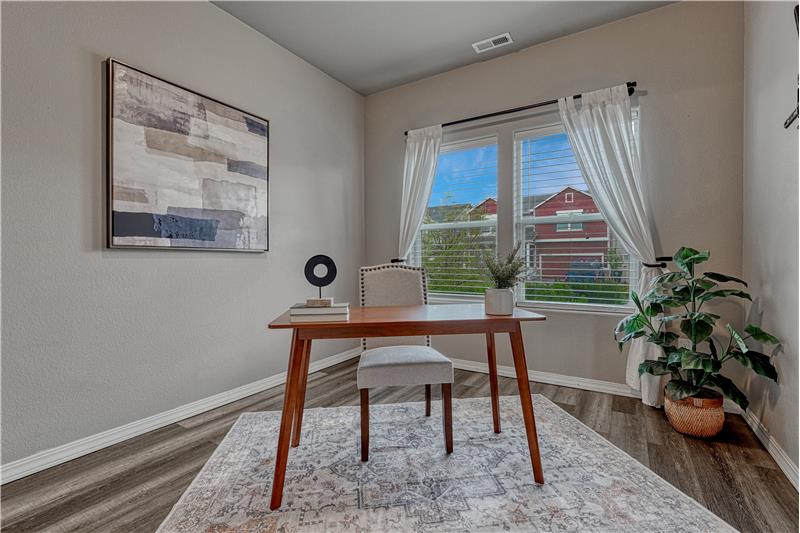 Back inside, Off of the entry is a Main Level Bedroom that is currently being used as an office