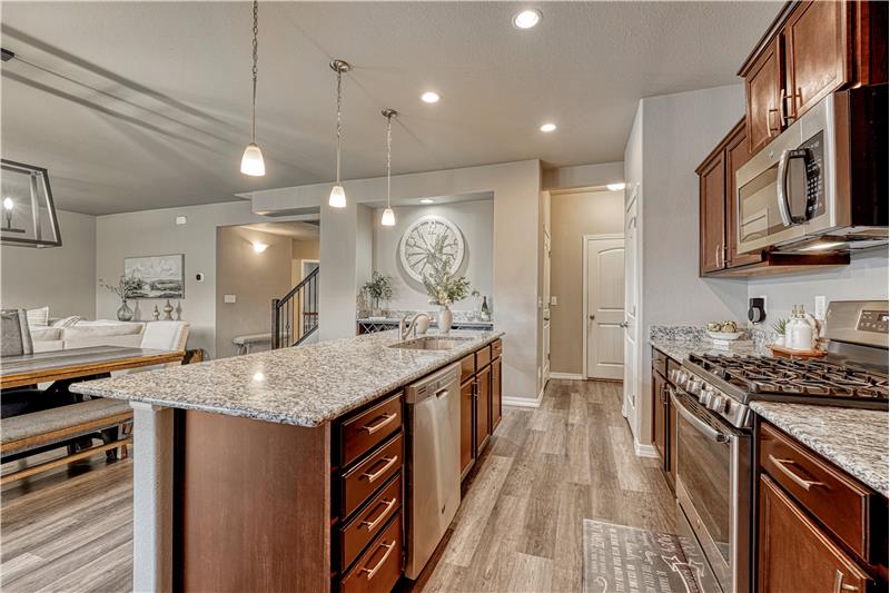 Recessed lighting and pantry with custom wood shelving that is sturdy, no wire shelves!
