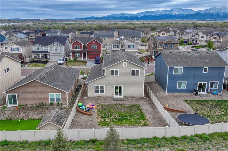 Aerial view of the backyard and home