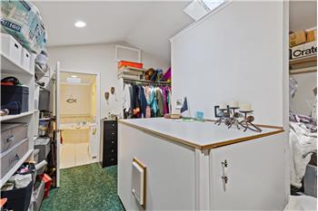 Double Primary Closet with folding table and storage