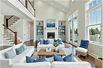 Great room in white with blue bookcases (digitally altered)