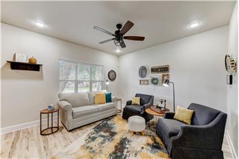 Living room with window facing road.