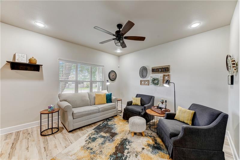 Living room with window facing road.