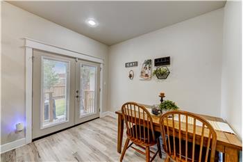 Dining area with French doors to outdoor space.