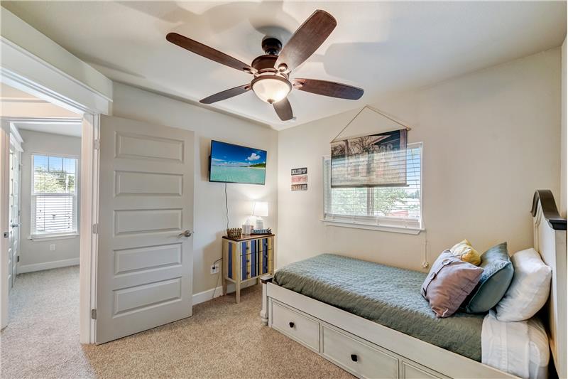 Secondary bedroom with spacious closet space and natural light.