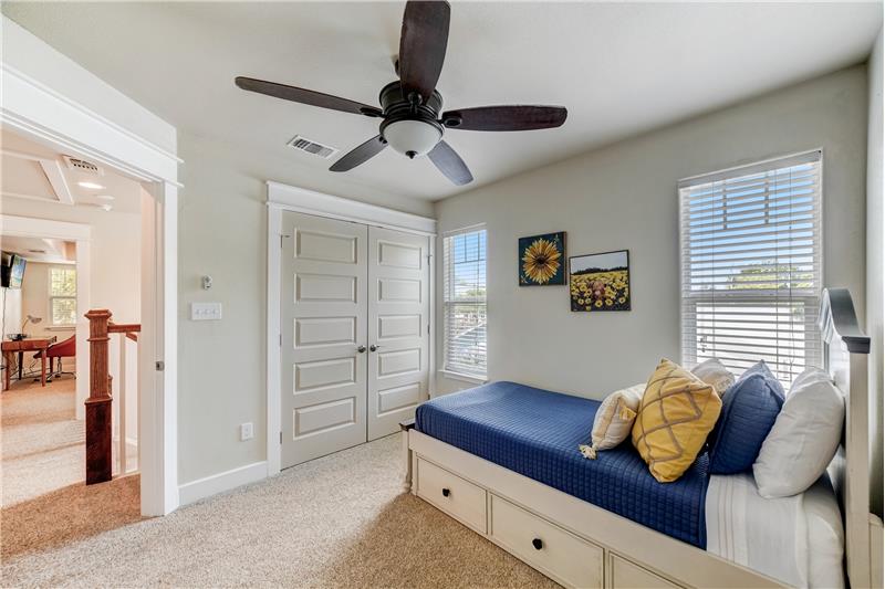 Secondary Bedroom with spacious closet space and natural light.