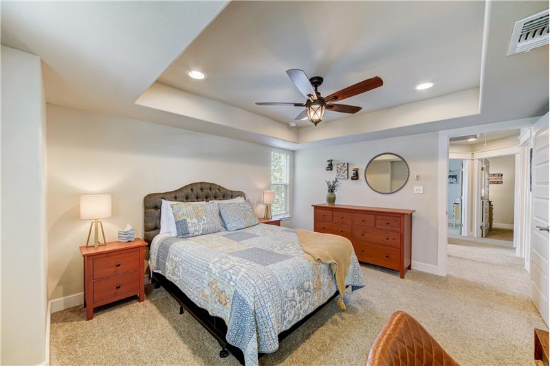 Master bedroom with spacious closets and natural light.