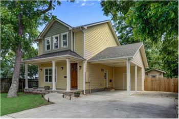 Front of home with carport and extra parking.