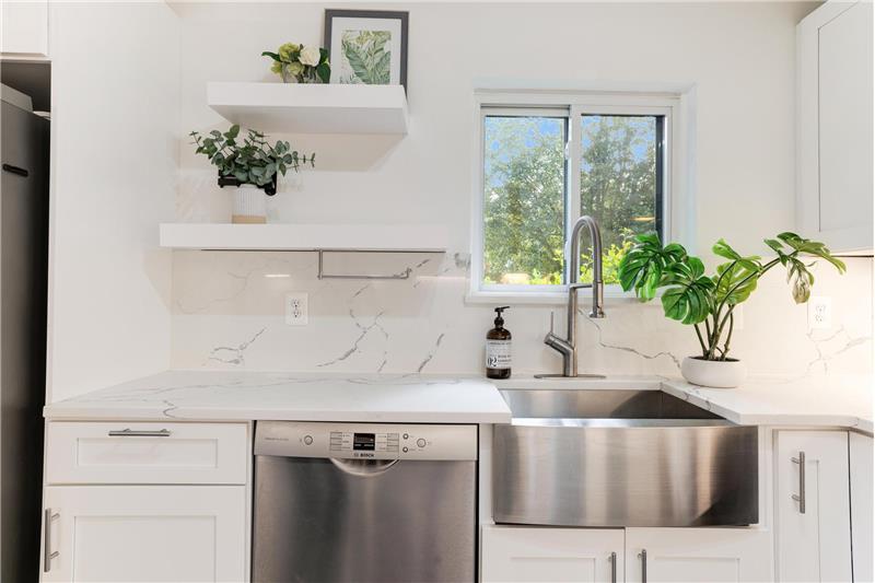 Stainless steel farmhouse sink.