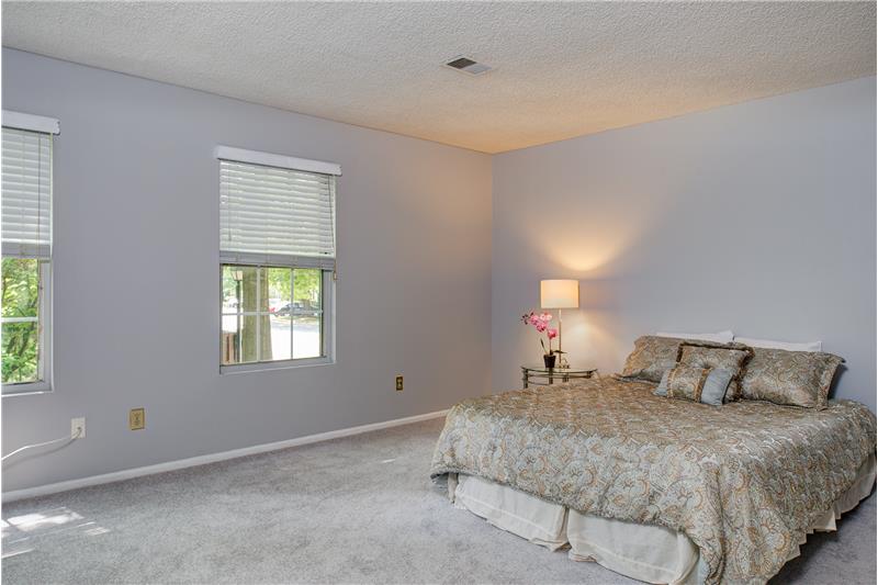 Check this spacious master bedroom for your lounging pleasure