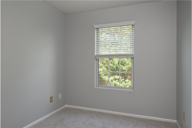 Second bedroom with treed views