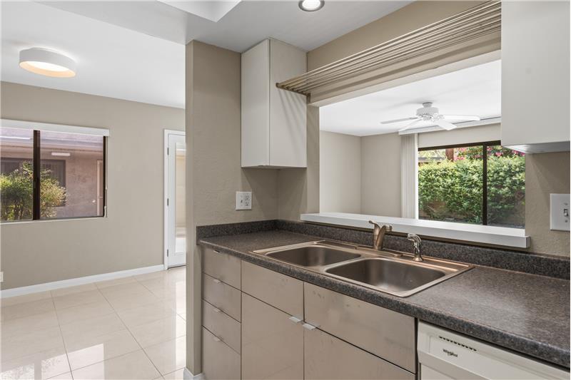 Kitchen has a pass through to Living area