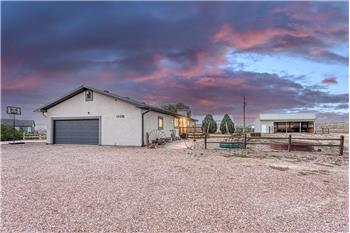 Set on 5.64 acres with 2,785 sf of well-designed living space, featuring an open floor plan with  spacious main-level bedrooms.