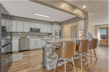 Gourmet Island Kitchen with double ovens, newer appliances, two pantries, & plenty of room for family gatherings.
