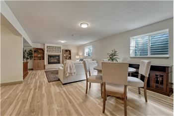 Large Family Room with gas fireplace, pre-plumbed for future wet bar or kitchenette.