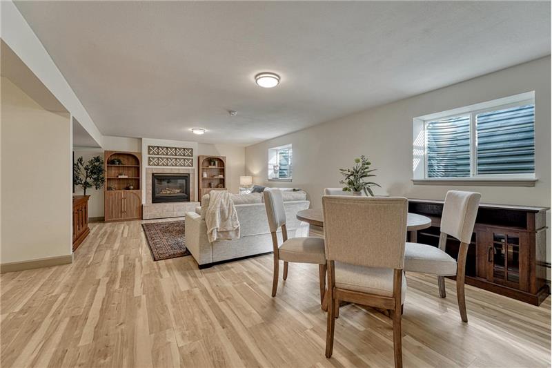 Large Family Room with gas fireplace, pre-plumbed for future wet bar or kitchenette.
