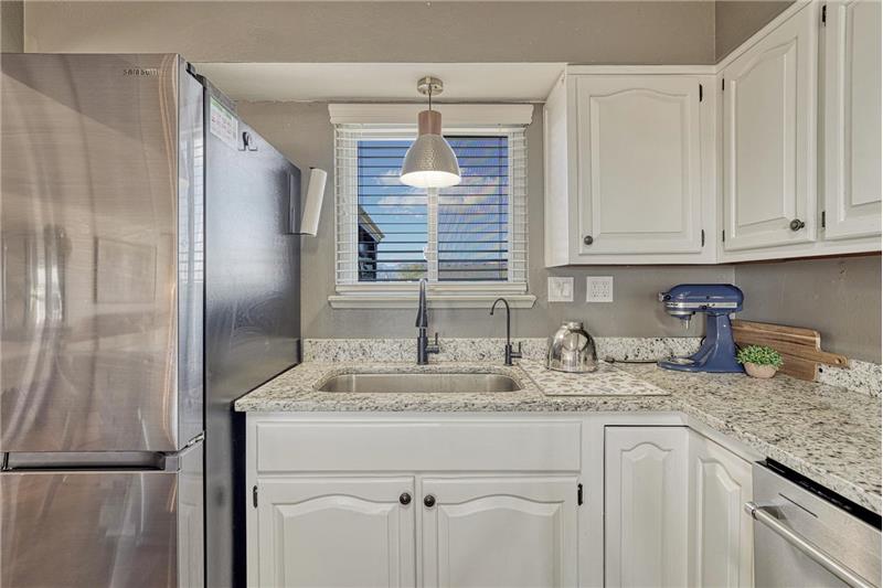Kitchen sink with outdoor views.