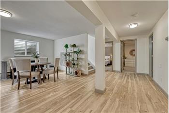 Basement Family Room with dining area and pre-plumbed for future wet bar or kitchenette.