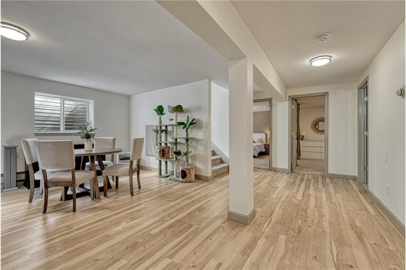 Basement Family Room with dining area and pre-plumbed for future wet bar or kitchenette.