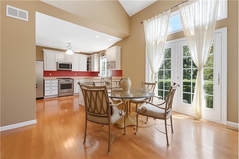 Dining room looking at the kitchen with SS appliances.