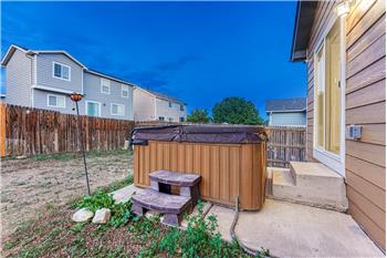 Backyard patio with hot tub included.