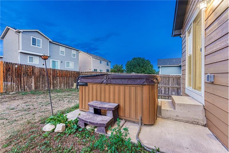 Backyard patio with hot tub included.