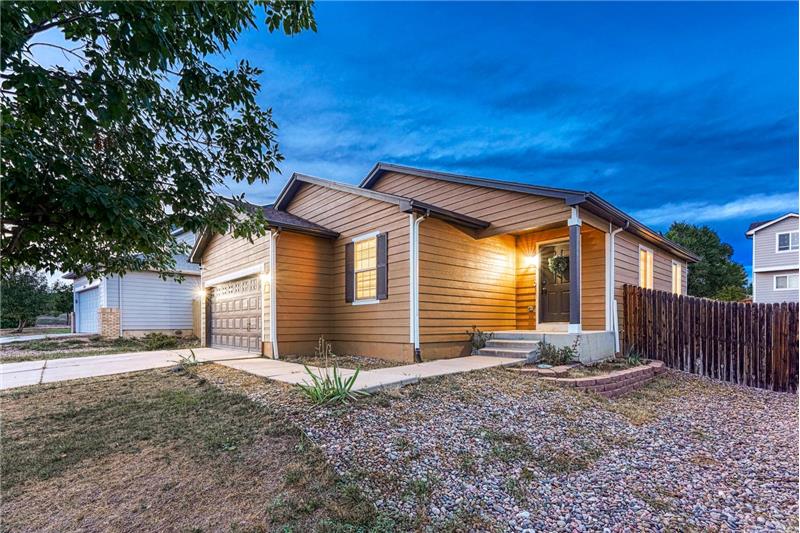 Low maintenance landscaping and covered front porch.