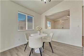 Light and bright Dining Area with view into the Living Room.