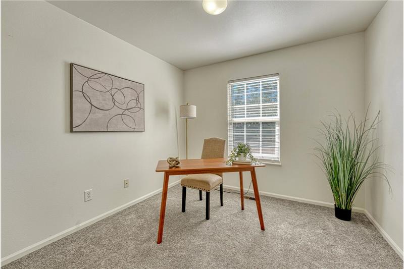 Bedroom #1 (currently an office) with new carpet.