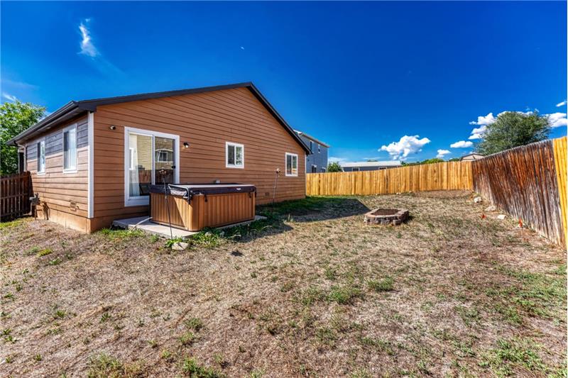 Lots of room in the fenced backyard for kids and pets to play.