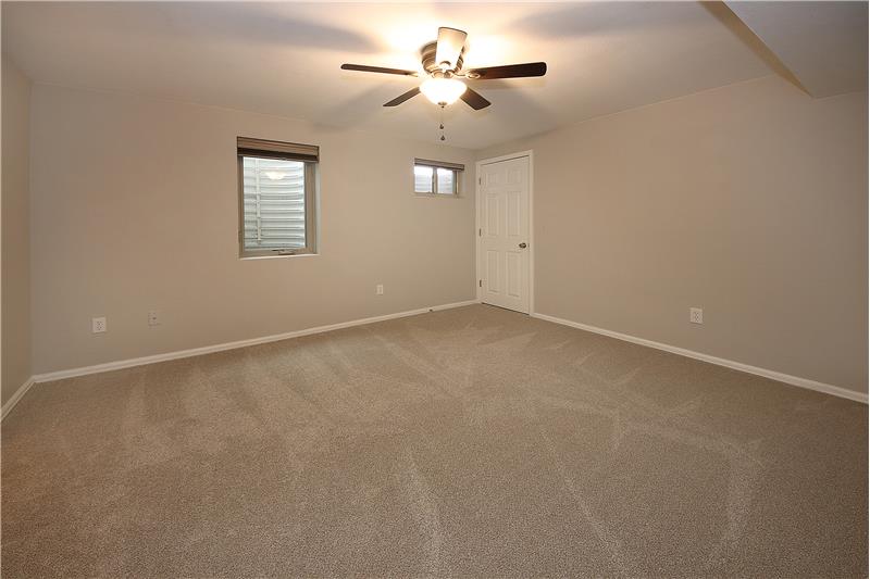 Bedroom 4 with new carpet, walk-in closet, and adjoining 3/4 bath