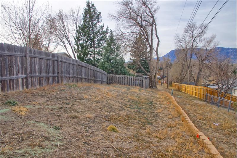Lot continues behind fenced backyard, so private!!
