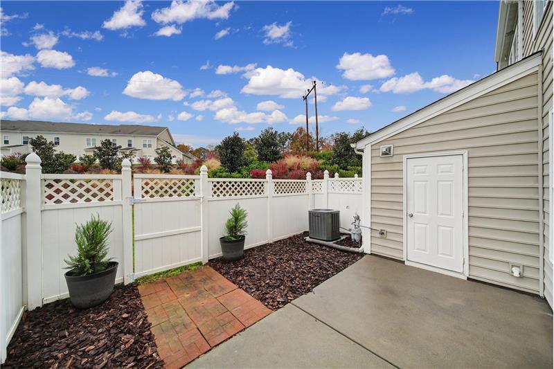 enclosed patio/backyard with storage room