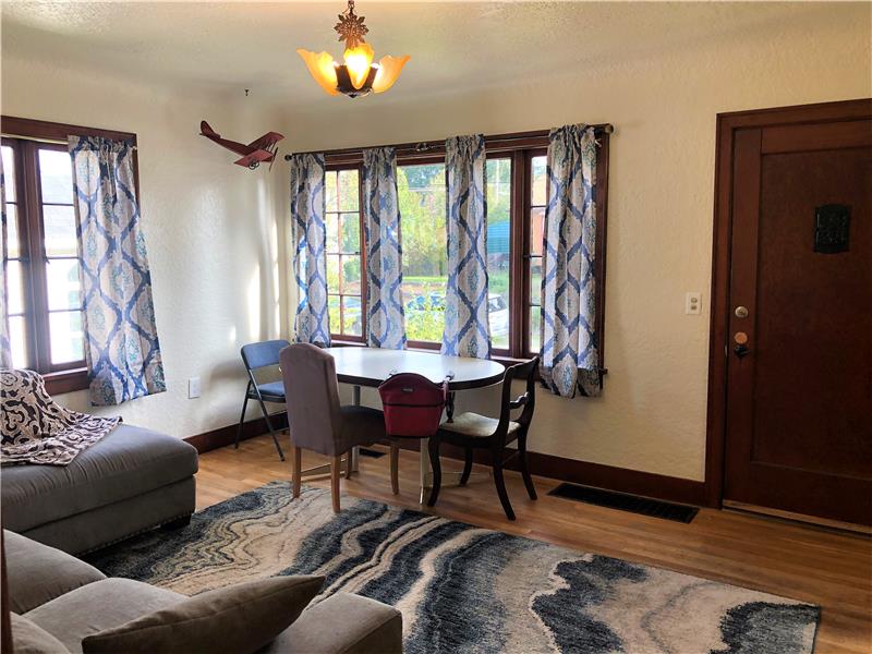 In the living room, you will find original windows that let in lots of natural light. Original hardwood floors.