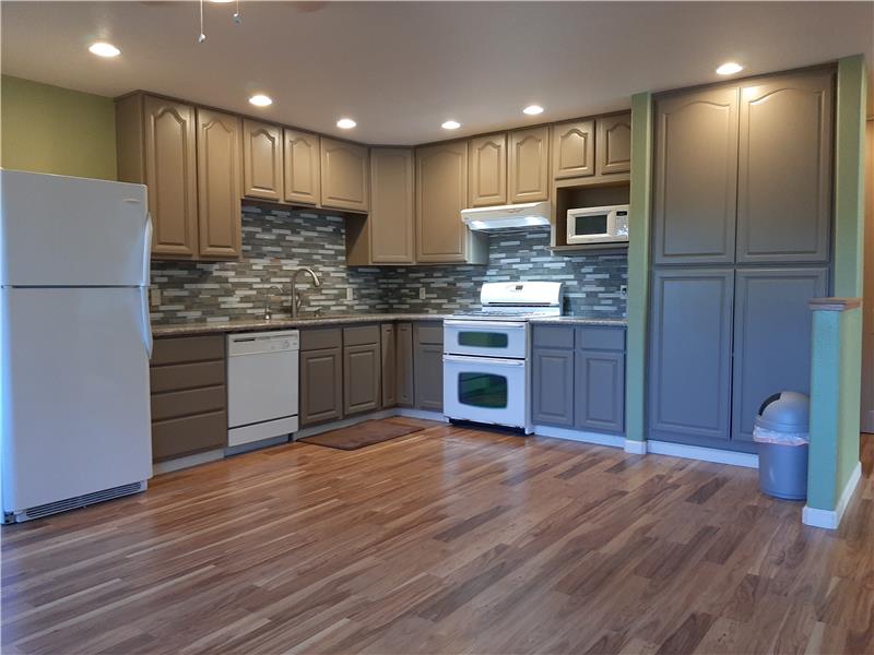 All the Comforts of New Construction are here right down to Granite Countertops, Brushed Nickle Fixtures & Mosaic Backsplash!