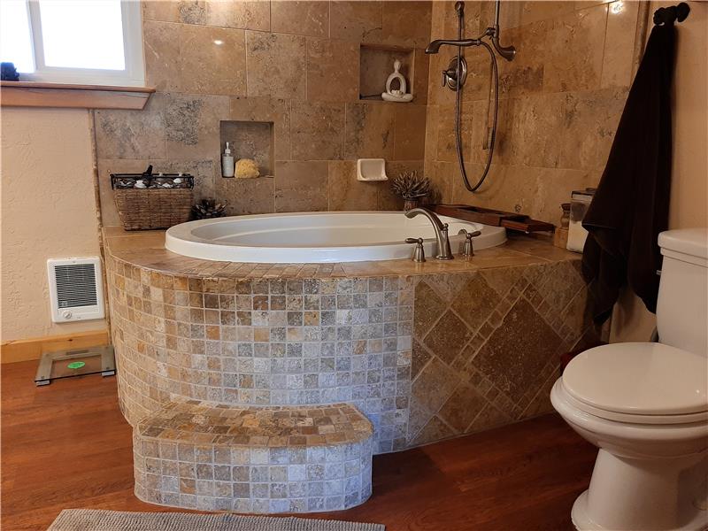 The custom Travertine Stone Work of the Primary Bathroom is Magnificent...