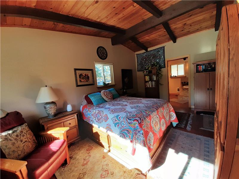 The Master Bedroom enjoys the same vaulted ceilings and design features carried throughout the home.