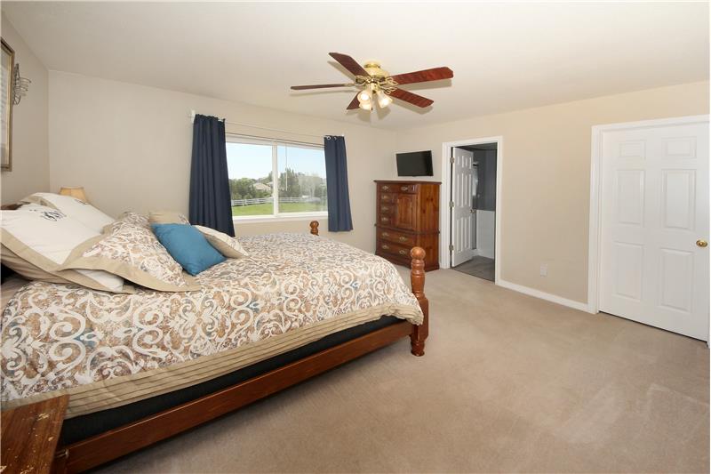 Large master bedroom with an adjoining 5-piece bath and walk-in closet