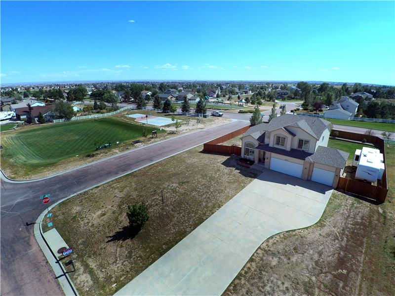 Aerial view of corner lot and nearby park