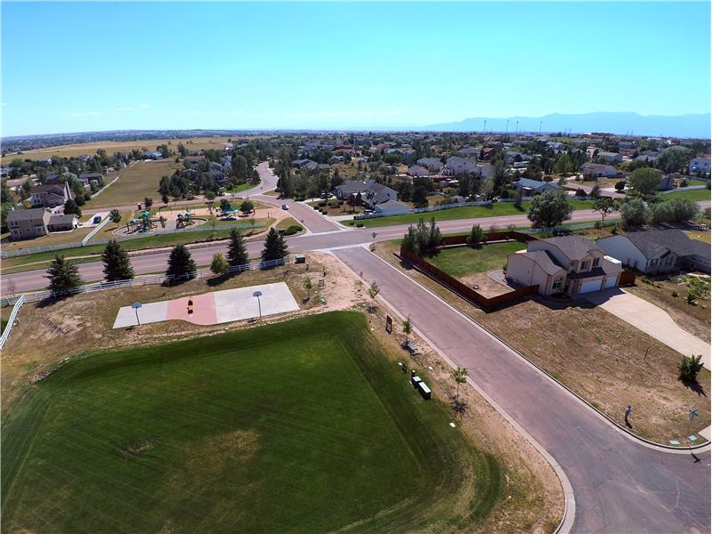 Aerial view of basketball court and nearby park