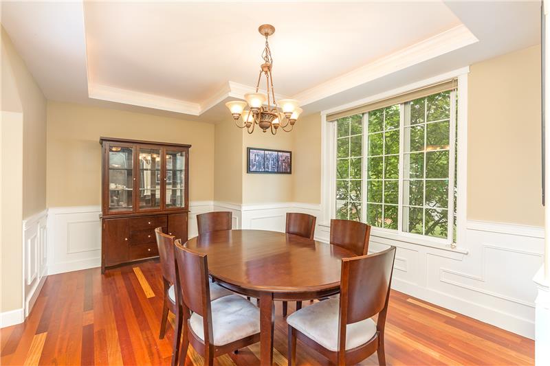 Big Dining Room with Coffered Ceiling, Rope Lighting, Gleaming Brazilian Cherry Hardwood Floors, Wainscoting and Chair Rails.