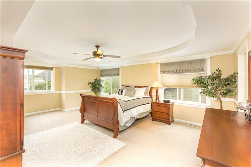 Huge, Light and Bright Master Bedroom with Chair Rail, Coffered Ceiling and Crown Molding.