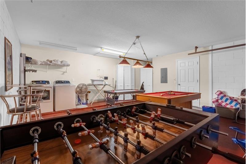 Game/Laundry Room Staged in Garage