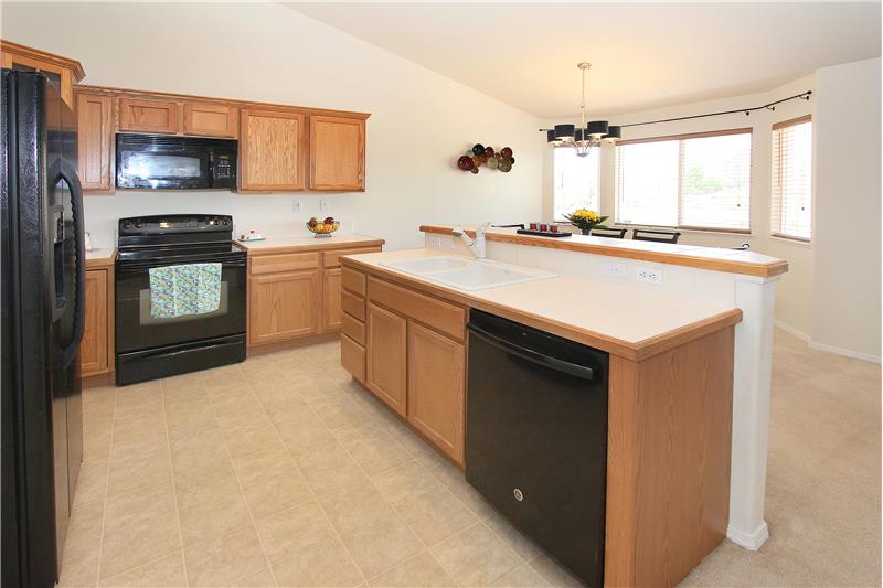 Counter bar, ample cabinet storage and counter top space